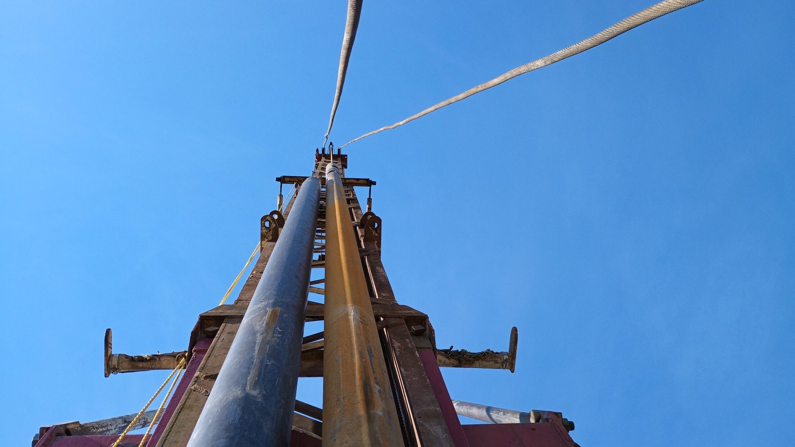 Looking Up the mast of the water well drilling rig